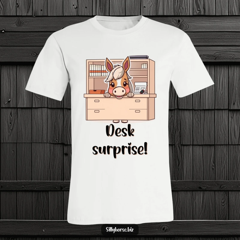 Funny t-shirt graphic of a horse character peeking excitedly from behind a large desk, hinting at a playful prank.